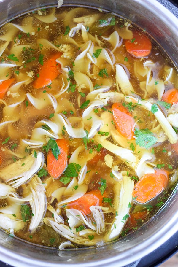 Instant Pot Pressure Cooker Chicken Noodle Soup -Tender chunks of chicken in a rich homemade chicken broth with big hearty veggies.