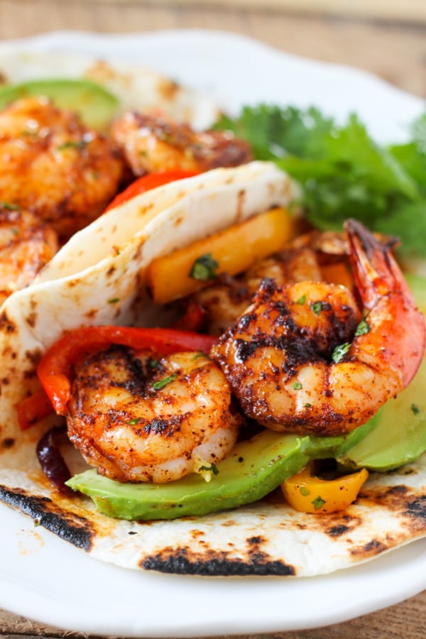 One Sheet Pan Shrimp Fajitas - tender juicy shrimp with roasted bell pepper and onion served in a soft warm tortilla. Perfect easy dinner idea! 