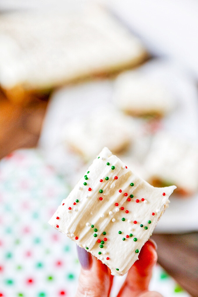 Christmas Sugar Cookie Bars -Frosted with homemade buttercream and packed with festive Christmas sprinkles, these sugar cookie bars are great for gift giving or serving a crowd.