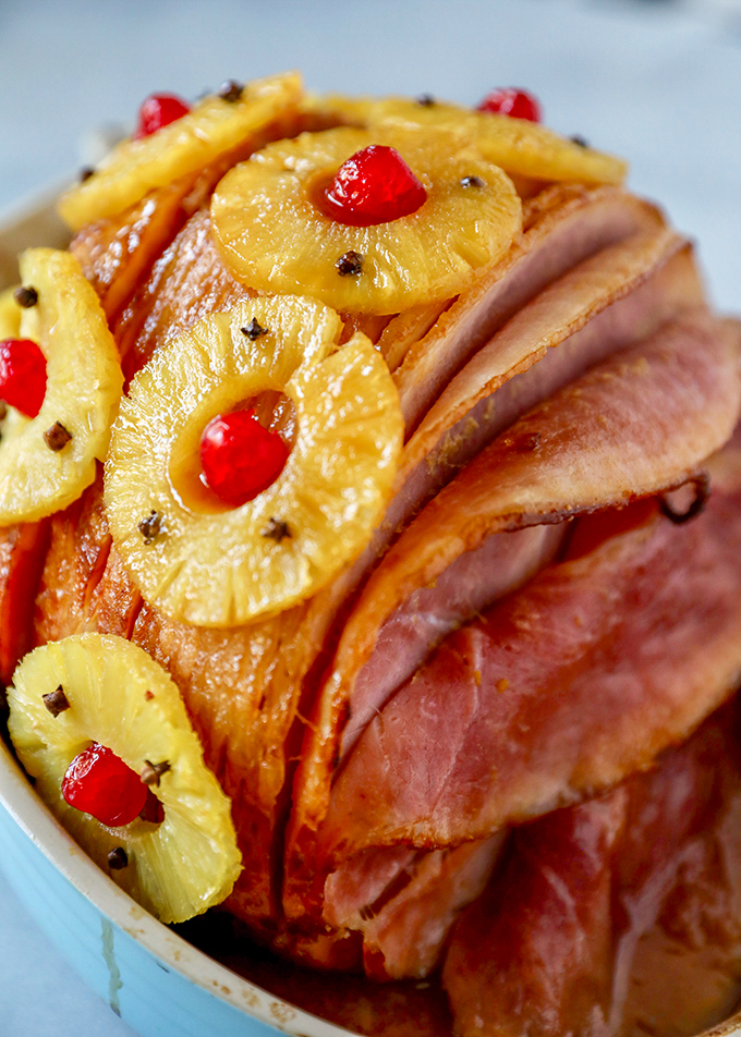 This Old-Fashioned Holiday Ham is the perfect Baked Ham Recipe. Spiral sliced ham glazed with brown sugar and pineapple juice and decorate with colorful pineapple slices and cherries.