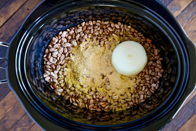 This is the easiest and best Refried Beans Recipe!  Cook and mash them right in your slow cooker, you won't go back to canned refried beans! 